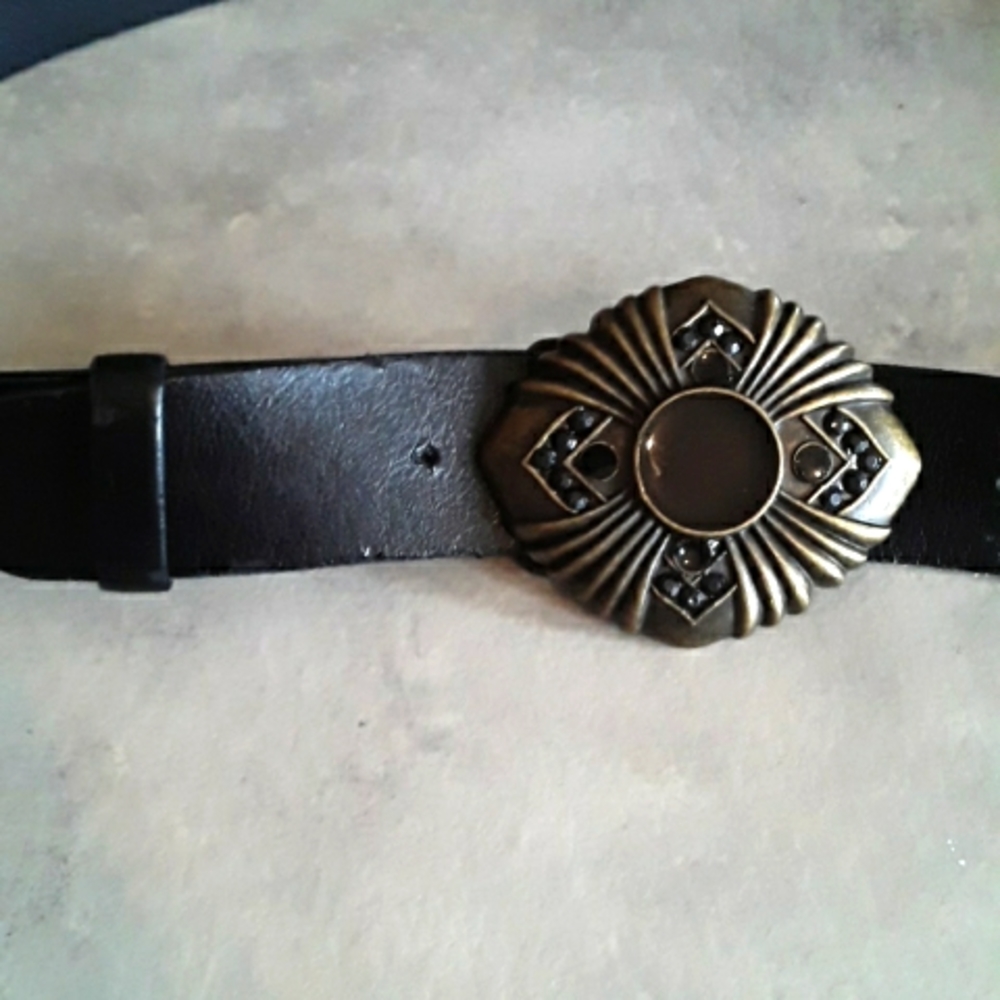 Synthetic leather belt with beautiful intricate metal buckle
